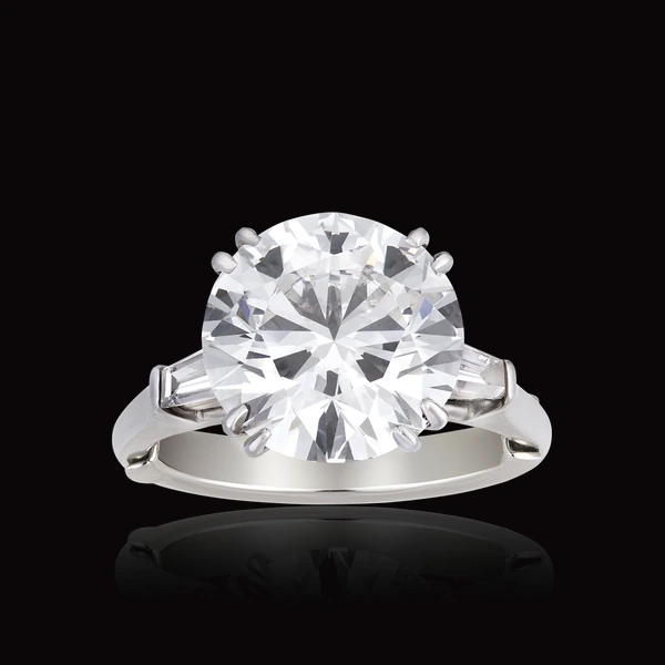 Bague, diamant taille brillant épaulé de diamants baguettes
